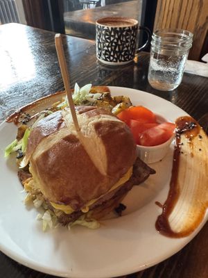 Burger with tomatoes on the sidee  at Revelstoke in Peterborough