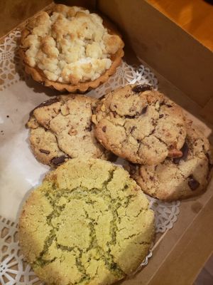 Chocolate chip walnut cookies, pistachio cookie, and a tart. at Sweet Maresa's in Kingston