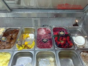 Five vegan flavors: chocolate, Mango-Passionfruit, black cherry, strawberry, and coconut. at Gelato Artesenal  in Uvita