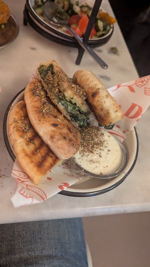 Pitas filled with spinach and cream cheese at HUMM Restaurant in Antwerpen