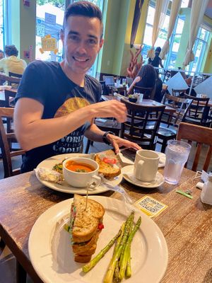 Avocado panini with side of asparagus. Tofu scrabble with tomato soup. Delicious ! Hip fun progressive space   at Busboys and Poets - Langston Lofts in Washington
