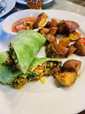 Tofu veggie wrap with home fries  at Busboys and Poets - Langston Lofts in Washington