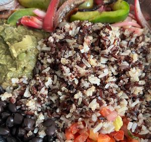 Bean and Rice Bowl with extra sautéed peppers and onions at Busboys and Poets - Langston Lofts in Washington
