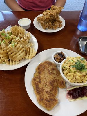 Poutine, fried chicken, schnitzel, and Mac and cheese. Poutine was our favorite at Manna Kitchen in Lisle