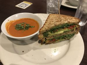 Vegan tomato soup and avocado panini at Busboys and Poets - Mount Vernon Triangle in Washington