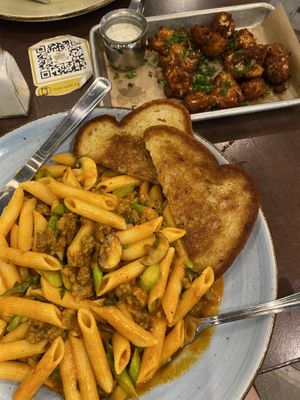Crispy Cauliflower Bites (upper right), vegan lover’s pasta  at Busboys and Poets - Mount Vernon Triangle in Washington