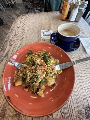 Oat cappuccino and vegan hash of scrambled tofu, mushrooms, onions, tomatoes, spinach, cauliflower, potatoes, and vegan sausage.  at Busboys and Poets - Mount Vernon Triangle in Washington