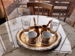 Turkish coffee whilst awaiting brekkie at Kawon once upon a time in Madaba