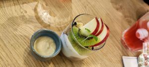 Verrine of plant-based yogurt, chestnut cream, homemade chocolate & tonka bean granola, fresh seasonal fruit at the friendly kitchen in Paris