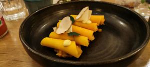 Special Diner : Ravioles de butternut, farce kaki et butternut, servies avec un bouillon champignons citronnelle et condiment citron, confit de gingembre at the friendly kitchen in Paris