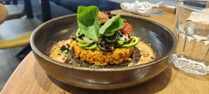  Einkorn risotto with roasted red bell peppers cream

Basil oil slivered zucchinis, zaatar savory crumble, kalamata olives sauce, preserved tomatoes, cashew ricotta, olives "soil at the friendly kitchen in Paris