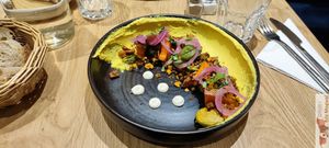 "Houmous with turmeric and preserved lemon
Emietté of tempeh, sweet potato, maple-roasted Brussels sprouts, red onion pickles, coriander shoots, dukkah, labneh with tahini"
 at the friendly kitchen in Paris