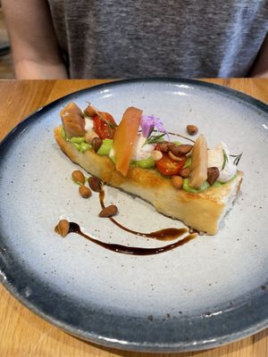 Focaccia with crème fraiche and savoury pickled peach   at the friendly kitchen in Paris