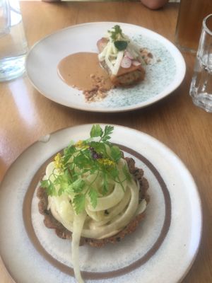 Fennel tartlet and spring roll (background)  at the friendly kitchen in Paris