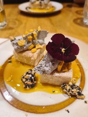 Le dessert : mochi, crème au sésame noir, et coulis de fruits de la passion at the friendly kitchen in Paris
