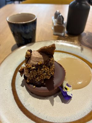 Chocolate fudge with tahini sauce, chocolate milk mousse, buckwheat and sesame biscuit; chocolate infusion at the friendly kitchen in Paris