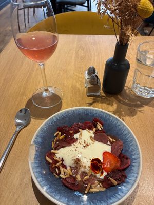 Mousse of aho blanco (Spanish garlic & almond soup) with strawberry and sumac marinated radishes; infusion of lavender, cherry, and verbena at the friendly kitchen in Paris