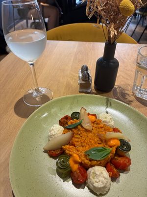 Risotto with einkorn, pickles, cherry tomatoes, peaches, red bell peppers, soy ricotta, and basil; fresh yuzu lemonade at the friendly kitchen in Paris