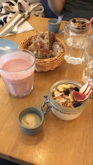 BRUNCH: Homemade granola with vegan almond yogurt, apple butter and bread, banana and raspberry smoothie. at the friendly kitchen in Paris