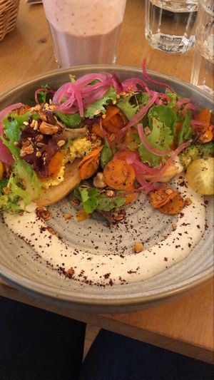 BRUNCH: pancakes (chickpea flour) with scrambled turmeric tofu, roasted veggies, salad, tahini sauce and salted granola.❤️ at the friendly kitchen in Paris