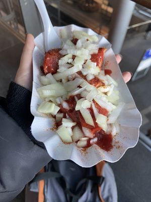 Vegan Currywurst with onions as an extra topping  at Curry 36 - Hauptbahnhof in Berlin