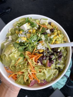 Rice, tofu, hummus, black beans, corn, carrot, pickled red onion, cilantro, and green lime dressing  at SEA - Evergreens in Seattle