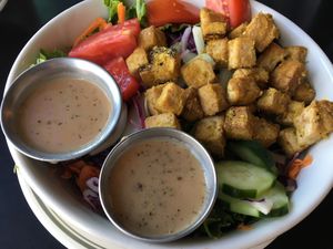Brunch salad with tofu cubes  at The Grit in Athens