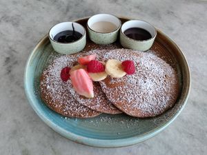 Very nice gluten free pancakes. More fruit please! at Honey & Dough in Nairobi