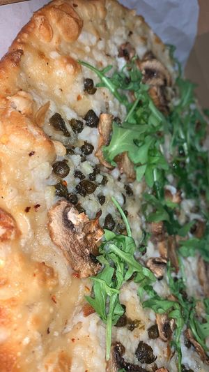 Mushroom with Arugula
Homemade white sauce, Vegan mozzarella cheese, mushrooms with garlic oil. Crushed red peppers, capers, and topped with fresh arugula. at Loving Hut in Charlotte