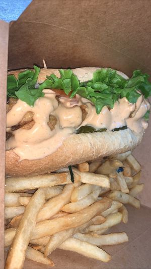  Shrimp Sub
Batter fried vegan shrimp, lettuce, tomato, pickle, capers, and spicy aioli sauce; served on a hoagie roll at Loving Hut in Charlotte