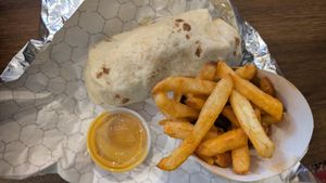 Chikn wrap, crack sauce and Cajun fries. at Moe Vegan in Kent