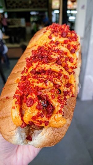 nacho cheese and bacon Beyond Sausage hot dog at Veggie Dojo in Central Singapore