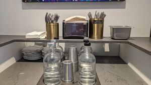 Stainless steel utensils, still and sparking water at noodlelove in New York City