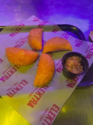 Empanadas with potato puree  and almond mozzarella and hogao (colombian sauce) and house dressing. at Elektra Punk & Food in Bogota