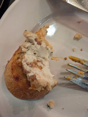 Ultimately spreadable cashew cheese on satisfyingly toasted and crunchy sliced baguette. at Blossoming Lotus - Irvington in Portland