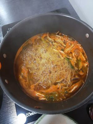 Some kind of soup with a lot of different mushrooms. at Dotori Kalguksu in Seoul
