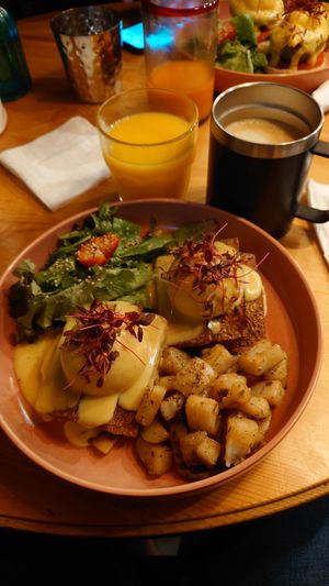 Vegan bacon tofu egg benedict, orange juice and cappuccino. at UT47 Manhattan in New York City
