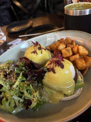 Vegan eggs Benedict with fried potatoes and side salad.   at UT47 Manhattan in New York City
