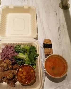lunch box with soup and tempeh sushi sides  at Peace Cafe - Shibuya Scramble Square in Tokyo
