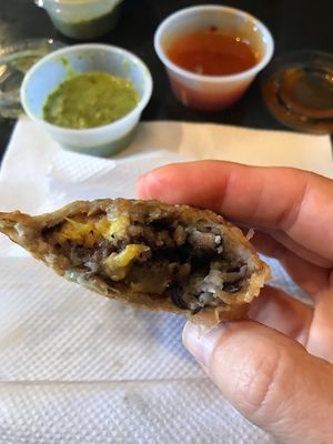 Typical Cubano Empanada with Cilantro Lime and Mango Habanero sauces at the Empanada Factory at The Empanada Factory in Wake Forest