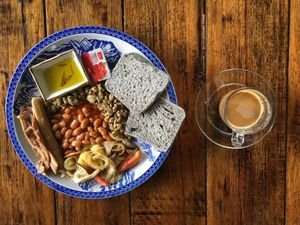 The Vegan Breakfast with bread, jam, baked beans, scrambled tempeh, vegan sausage, vegan bacon, roasted veg, olive oil and a coffee (with coconut milk) at Big Mountain in Koh Phangan