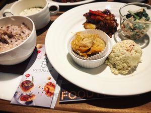 4 piece dish, fried chicken in spicy sauce (winner), veggie dumplings, potato salad and peanut and fig salad. Comes with soup and a rice or bread. at Upgrade Plant Based Kitchen in Osaka
