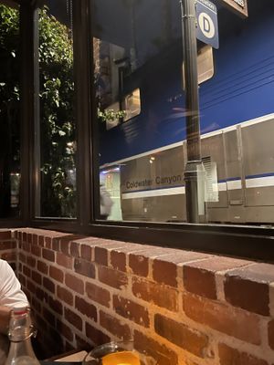 Amtrak Surfliner making a stop   at Trevor's at the Tracks in San Juan Capistrano