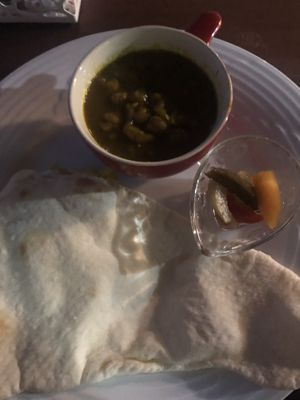 Curry set with vegan curry, vegan naan, pickles, and rice (under the naan) at Yamashita in Uruma