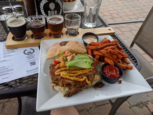 Housemade southwest burger with sweet potato fries, and a flight of the house beers. at BrickHouse in Patchogue