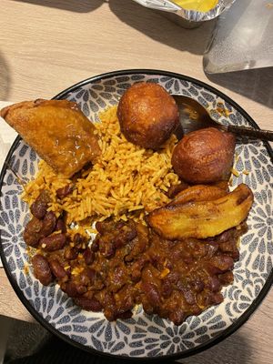 Samosa, puff puff, plantain, jollof rice and beans - yummy!!!  at Patacon-Obi - Falafel Café in Stuttgart