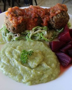 Lentil "meat balls" with zucchini spaguetti & broccoli puree at Corazón de Hemp in Cabo San Lucas