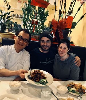 With Chef Kenny and his new crispy spicy eggplant dish. We like it! at Chef Kenny's Asian Vegan Cuisine in Houston