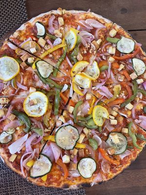 Vegan pizza with tofu   at Hope Cafe in Pondicherry