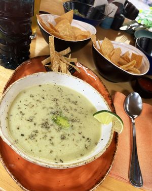 Vegan Verde soup with vegetables, corn, avocado, oil and crispy bread at Los Pueblos in Yerevan
